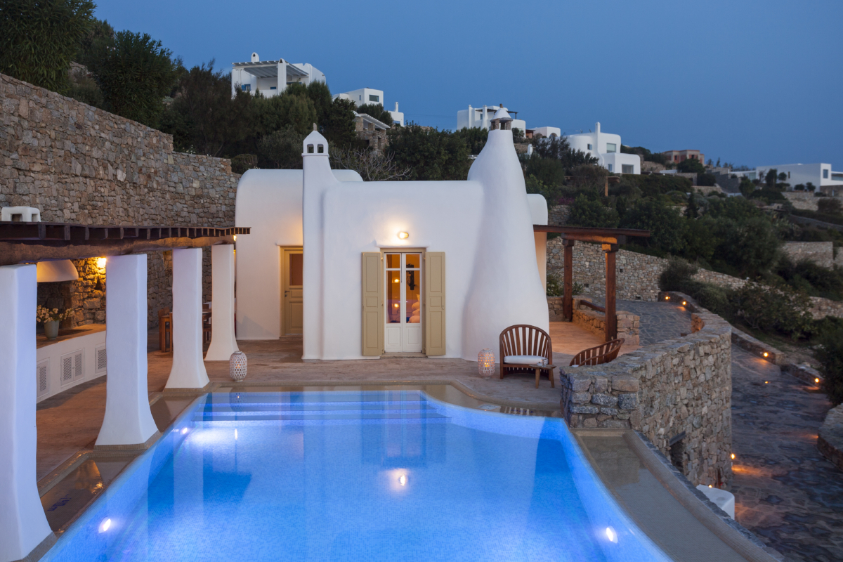 Apollonia Villa of AGL's Mykonos pool villas evening view of the pool