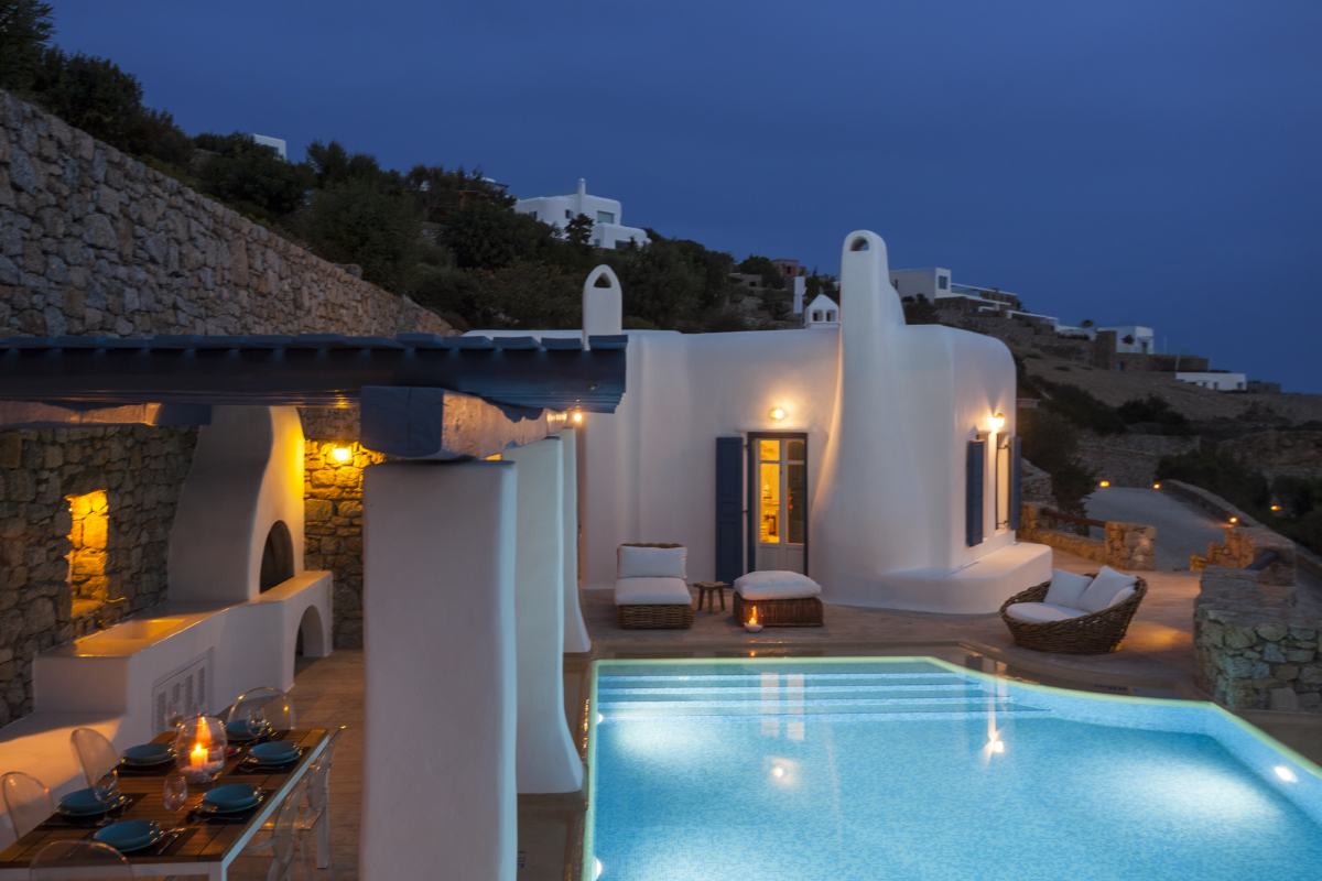 The exterior of Villa Dafne, a Mykonos infinity pool villa by AGL after sundown