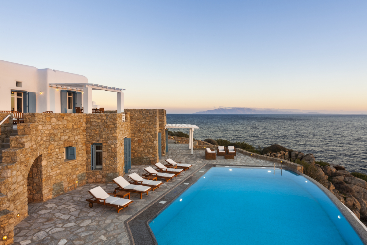 Sunset hour and pool at Villa Posidonia, a Mykonos luxury villas with seaview by AGL
