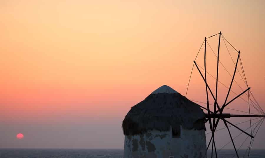 Sunset strewn sky and windmill in Mykonos