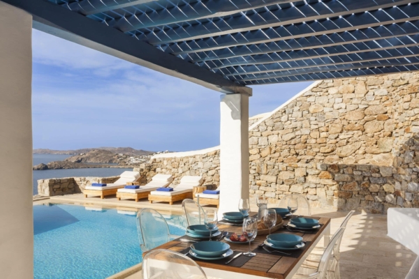Dining area next to the pool at AGL Luxury Villas Mykonos suitable for families