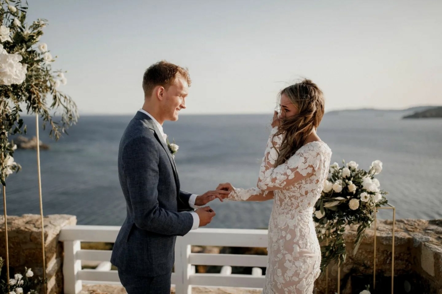 Happy couple exchanging their vows at their Mykonos wedding villa by AGL Luxury Villas
