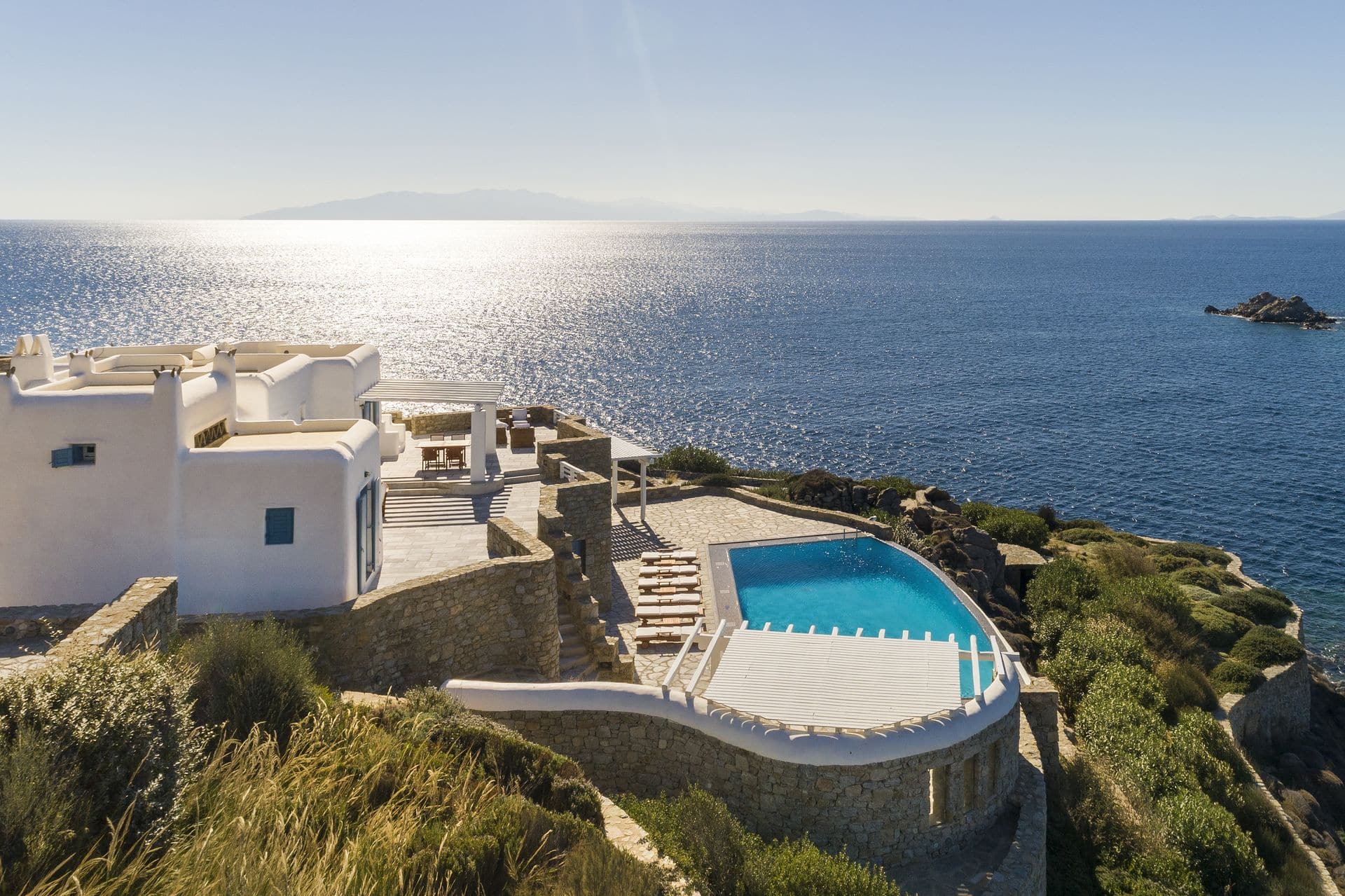 One of AGL Luxury villas in Mykonos with pools, aerial view.